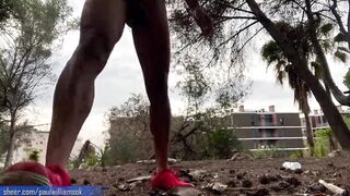 Perfect fitness body man doing naked squats in public