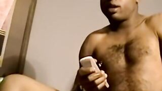 Black amateur working on his dick and making it cum