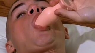 Smoking twink plays with a big butt plug and his fat cock