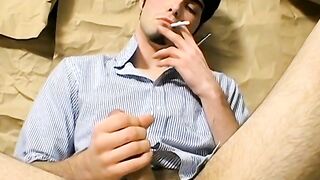 Young chain smoker wanking and stroking his big cut boner