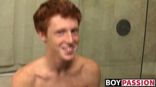 Redhead twink Alan Parish masturbates and cums under shower