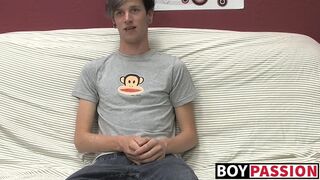 Adorable gay guy Danny jerks off his dick on couch solo