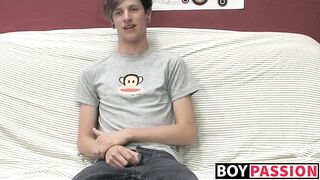 Adorable gay guy Danny jerks off his dick on couch solo