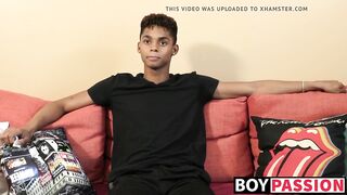 Black young man gives an interview and stimulates himself