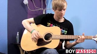 Young man plays guitar before dick stroking and cumming