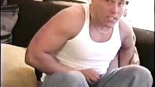 Straight muscular hunk wanking on couch