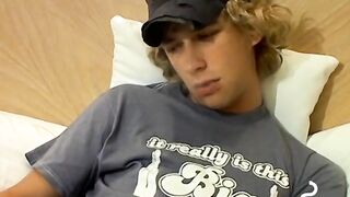 Blonde twink Casey Wood jerks off his dong while smoking