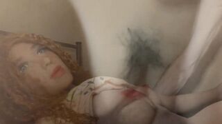 Very hairy uncut white guy fucks a freckled redhead sex doll on the bed