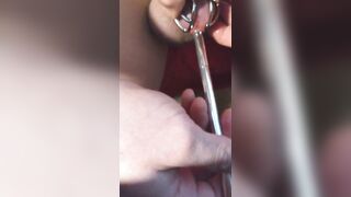 sissy sounds herself in a shiny metal cock cage