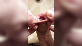 Extreme closeup playing with foreskin and piss, then wanking a string of thick cum into my hand