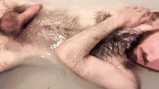 Uncut white guy washing myself and showing off my very hairy pale body in the bathtub