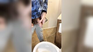 Side view of my very hairy big uncut dick pissing in the toilet