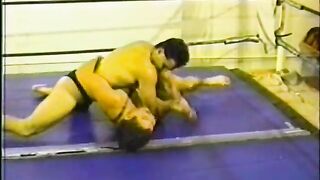 Two fit wrestlers fight naked in a boxing rink