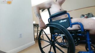 Handicapped guy wheels around hotel room naked in wheelchair