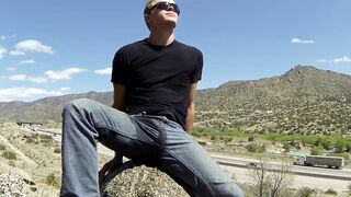 Wetting jeans and white briefs near a highway