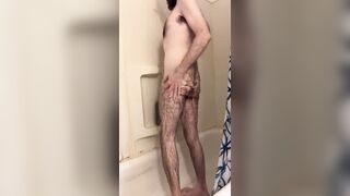 Skinny hairy white dude with a big uncut cock takes a quick shower