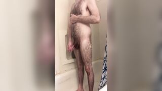 Skinny hairy white dude with a big uncut cock takes a quick shower