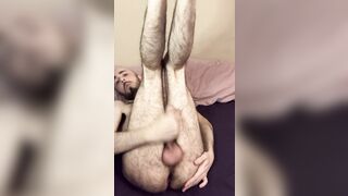 Very hairy skinny blue-eyed white guy jerks off big uncut cock with legs in the air