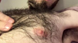 Dripping oil over and playing with my very hairy chest and nipples