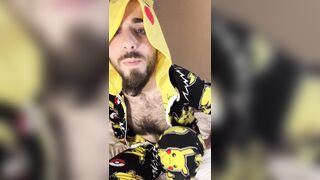 Bald bearded blue-eyed white otter in cute onesie pajamas strips down to tease very hairy ass with a gaming controller