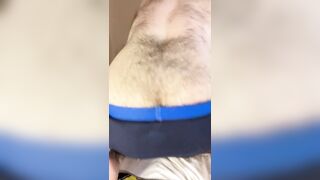 Bald bearded blue-eyed white otter in cute onesie pajamas strips down to tease very hairy ass with a gaming controller