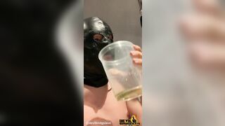 Devilbondageslave in chastity drinking his own piss